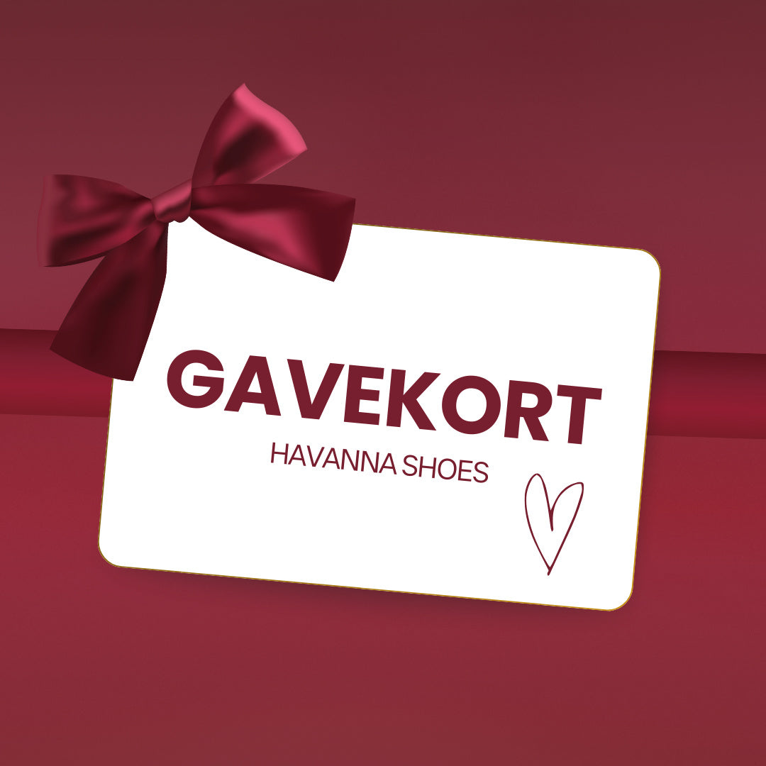 Gavekort med teksten "GAVEKORT HAVANNA SHOES" på en rød baggrund med en rød sløjfe og et hjerte.