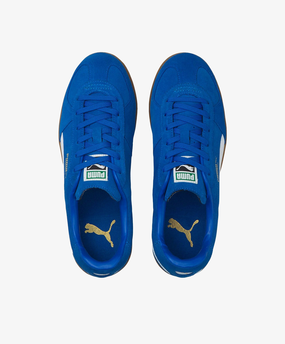 Blå Puma sneakers set ovenfra med hvidt logo og guld detaljer på tungen.