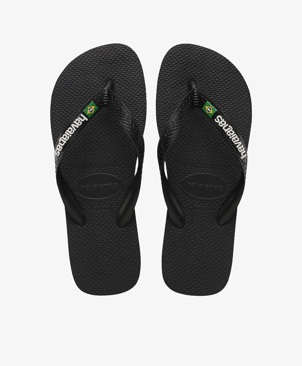 Sorte Havaianas slip-ins med logo og brasiliansk flag.