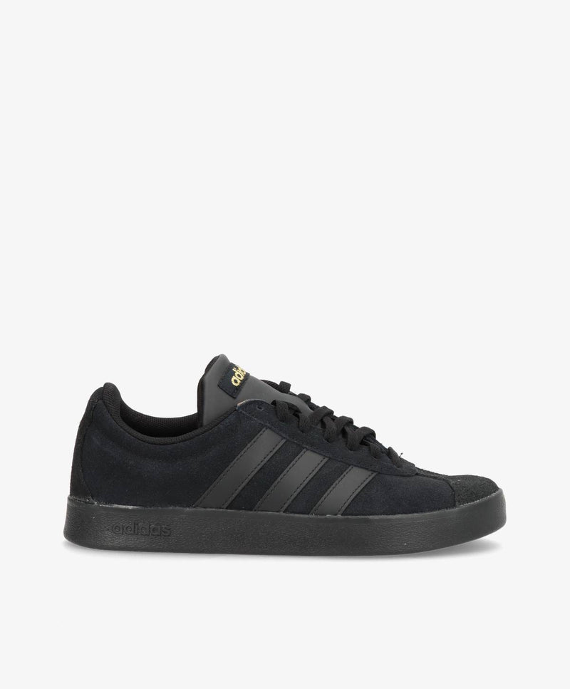 Sorte Adidas sneakers med guldlogo på pløsen og logostriber på siden.