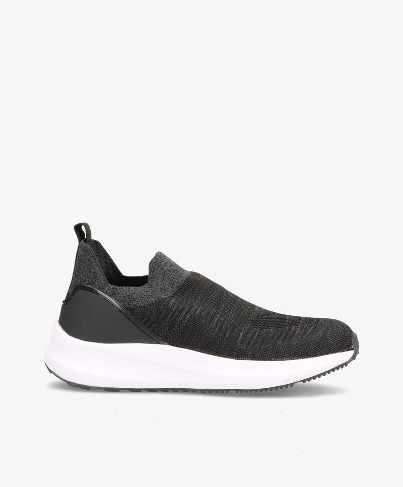 Sort slip-on herresko med hvid sål og grå detaljer, set fra siden.