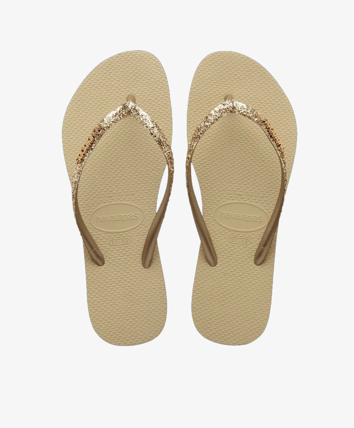 Beige Havaianas slip-ins med glitterremme.