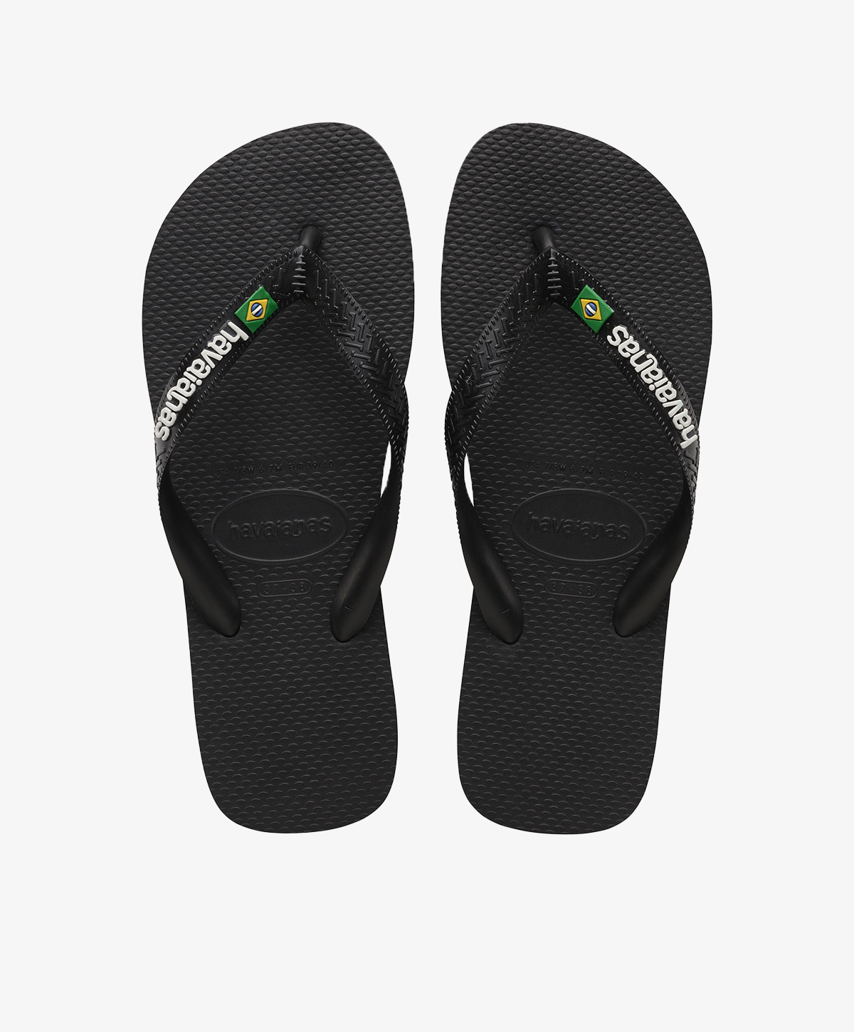 Sorte Havaianas slip-ins med logo og brasiliansk flag.